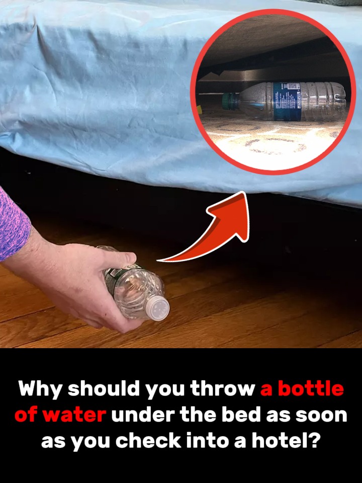 Why should you throw a bottle of water under the bed as soon as you check into a hotel?